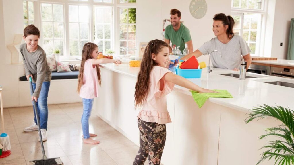 a family doing the weekly cleaning